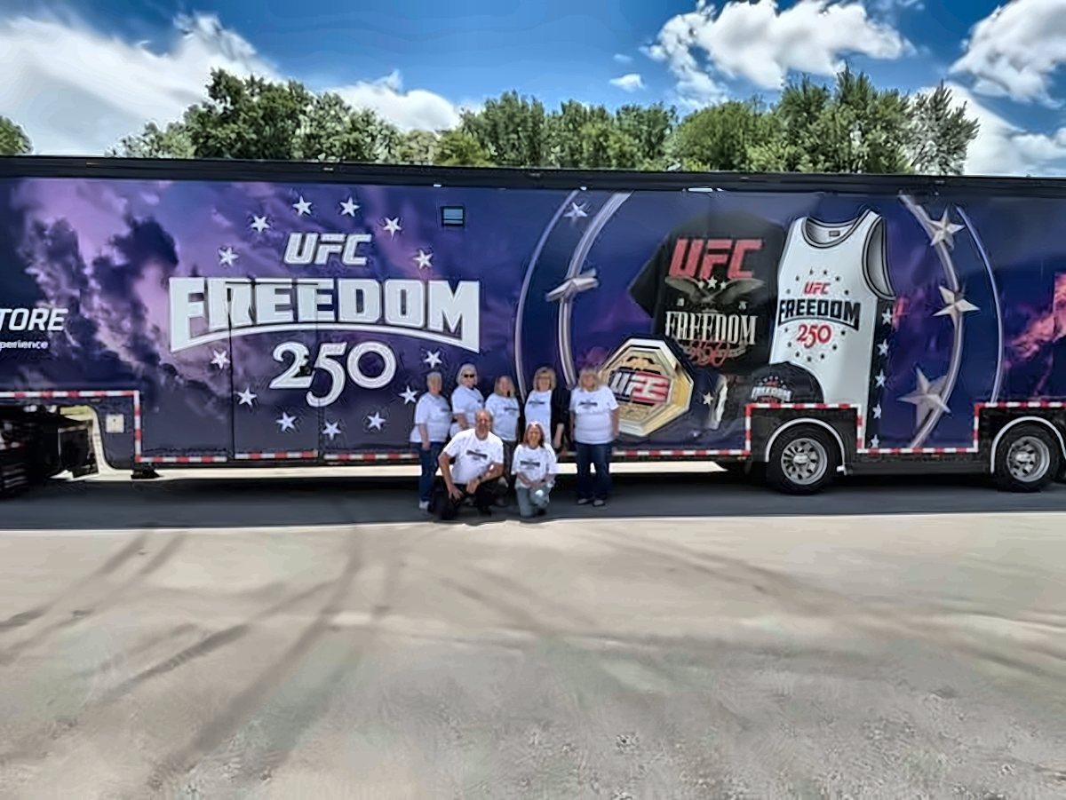 CW crew lined up in front of a trailer